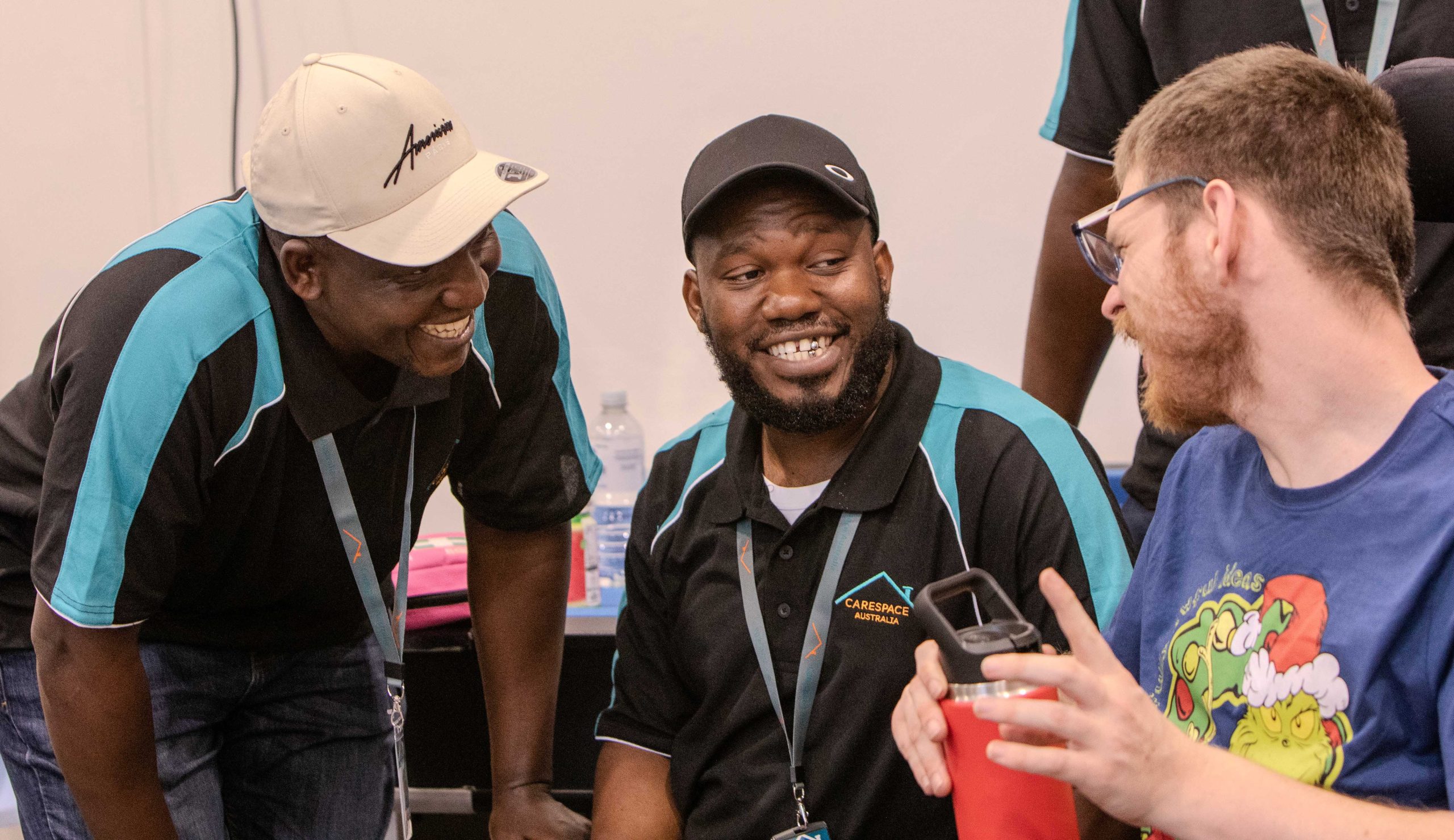 Carespace team members and a participant talking together